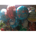 Cluster of colorful foil balloons with messages like Thank You and Get Well Soon