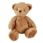 Tan plush teddy bear sitting on a white background