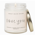 Glass jar candle with a gold lid and "love you" label