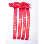 Four red satin ribbons with "I love you" text and bows