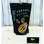 Bag of caramel pecan popcorn on a white surface