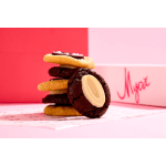 Stack of sandwich cookies with cream filling and a gift box in the background