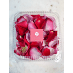 Clear plastic box filled with red and pink rose petals