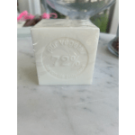 White boxed candle with embossed logo on a marble surface