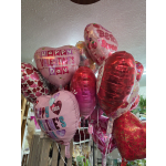Cluster of pink and red heart-shaped Valentine balloons