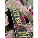 Pink rose bouquet with a sheer ribbon reading "Graduated"