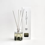 Sea salt and eucalyptus reed diffuser in a glass bottle with a white box