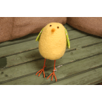 Small yellow felt bird figurine with orange wire legs