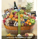 Large gourmet fruit and sweets gift basket with fresh fruit, chocolates, cookies, and snacks tied with a green bow