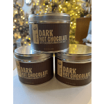 Three tins of dark hot chocolate stacked on a table