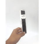 Hand holding a box of chocolate toffee pieces