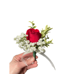 Red rose boutonniere with baby's breath and ribbon