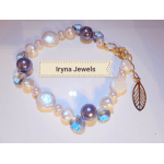 Beaded bracelet with pearl, purple, and blue beads and a leaf charm