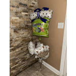 Cluster of birthday balloons with a large gift-shaped balloon and crown balloons