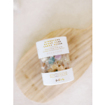 Jar of assorted candy cube hand scrub on a wooden surface