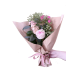 Pink rose bouquet wrapped in blush paper with a striped ribbon