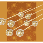 Gold-wrapped lollipops on orange patterned paper