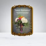 Bouquet of white and pink flowers in an ornate gold frame