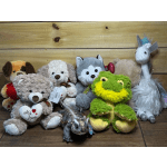 Assorted plush animals including teddy bears, a frog, a unicorn, and a dog