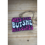Handmade hanging sign with pink and white text on a black background