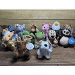 Assorted plush animal toys arranged on a wooden surface