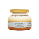 Glass jar candle with a wooden lid and Mandarin & Guava label