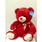 Red plush teddy bear with a heart-pattern ribbon