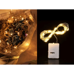 Bouquet wrapped in paper with warm string lights and dried flowers