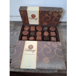 Open box of assorted chocolates in a decorative gift box