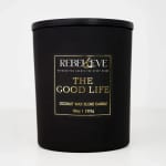 Black candle jar with a gold-and-white label