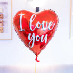 Red heart-shaped balloon with "I love you" text
