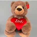 Brown teddy bear holding a red heart with the word Love