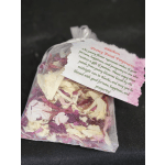 Mesh bag of dried pink and white flower petals with a printed tag