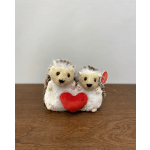 Two plush hedgehogs holding a red heart