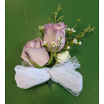 Lavender roses with small white filler flowers and a white bow