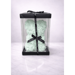 Mint rose-shaped teddy bear in a clear gift box with black ribbon