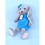 Gray plush bunny in a blue polka-dot dress with a bow