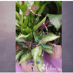 Potted green foliage with decorative beaded dragonfly picks