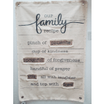 Fabric wall hanging with the words "our family recipe" and stitched accents