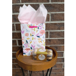 Gift bag with pink tissue paper and Ferrero Rocher chocolates