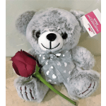 Gray teddy bear holding a red rose
