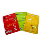 Three facial mask packets in red, green, and yellow packaging