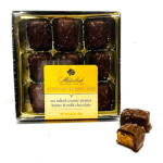 Box of chocolate-covered peanut butter candies with two pieces outside