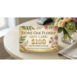 Florist gift card with illustrated flowers on a table beside a small vase of roses and hydrangeas.