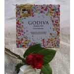 Godiva chocolate gift box with a red and white rose corsage