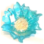 Blue glass flower-shaped bowl with a pale textured center