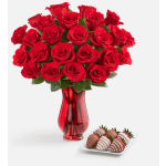 Red roses in a red glass vase with chocolate-covered strawberries on a tray