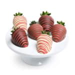 Chocolate-covered strawberries on a white pedestal stand