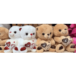 Plush teddy bears holding heart-shaped pillows with "you are" text