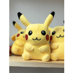 Three Pikachu plush toys on a wooden shelf